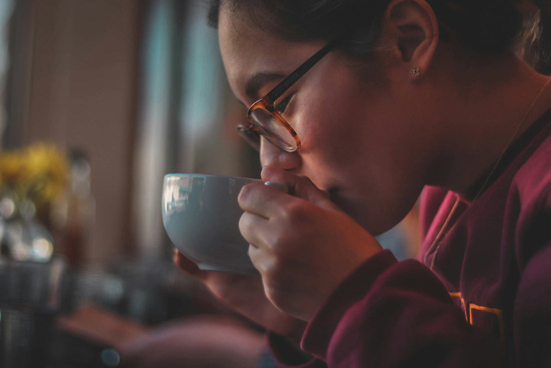 Woman drinking decaf coffee