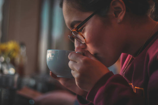 Woman drinking decaf coffee