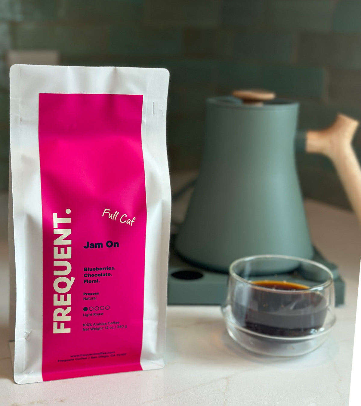 Bag of Jam On full caf coffee from Frequent Coffee next to a coffee cup