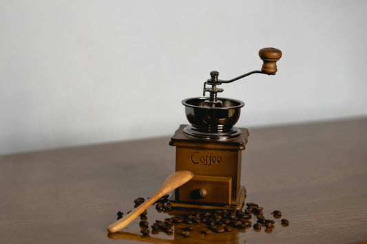 old coffee grinder on wood table decaf coffee