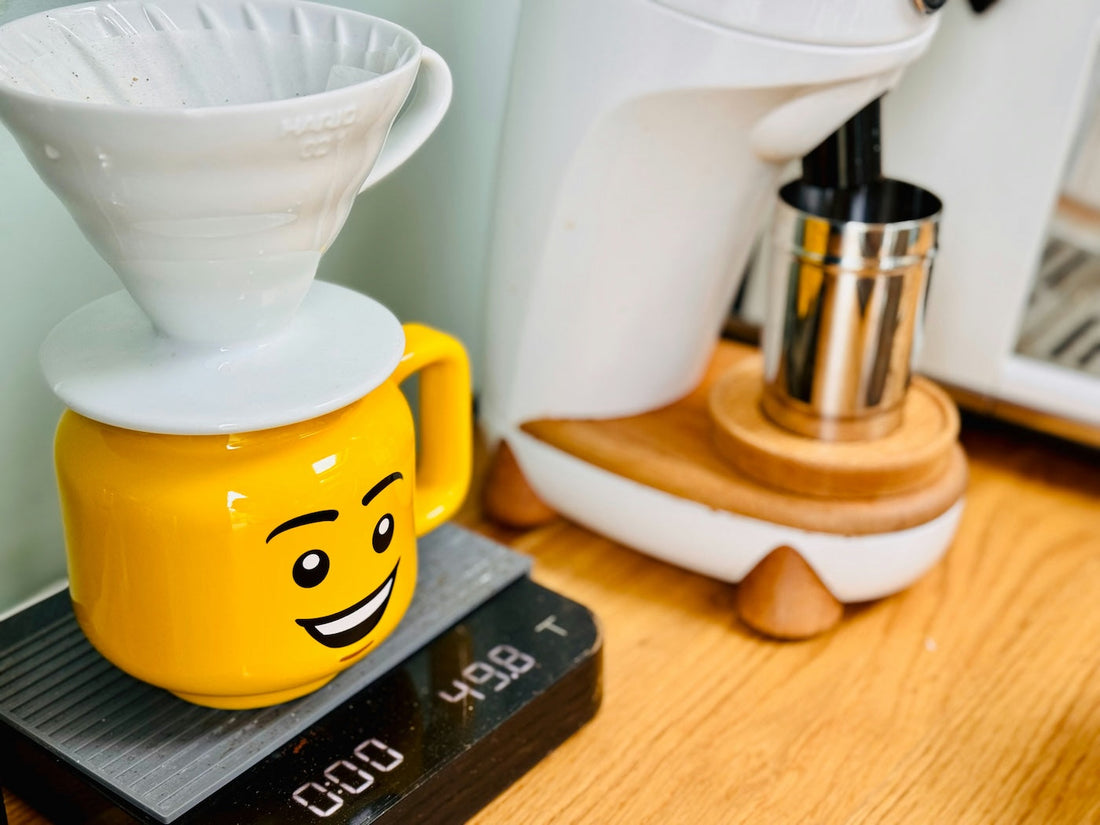 lego decaf coffee mug with decaf coffee v60 on top