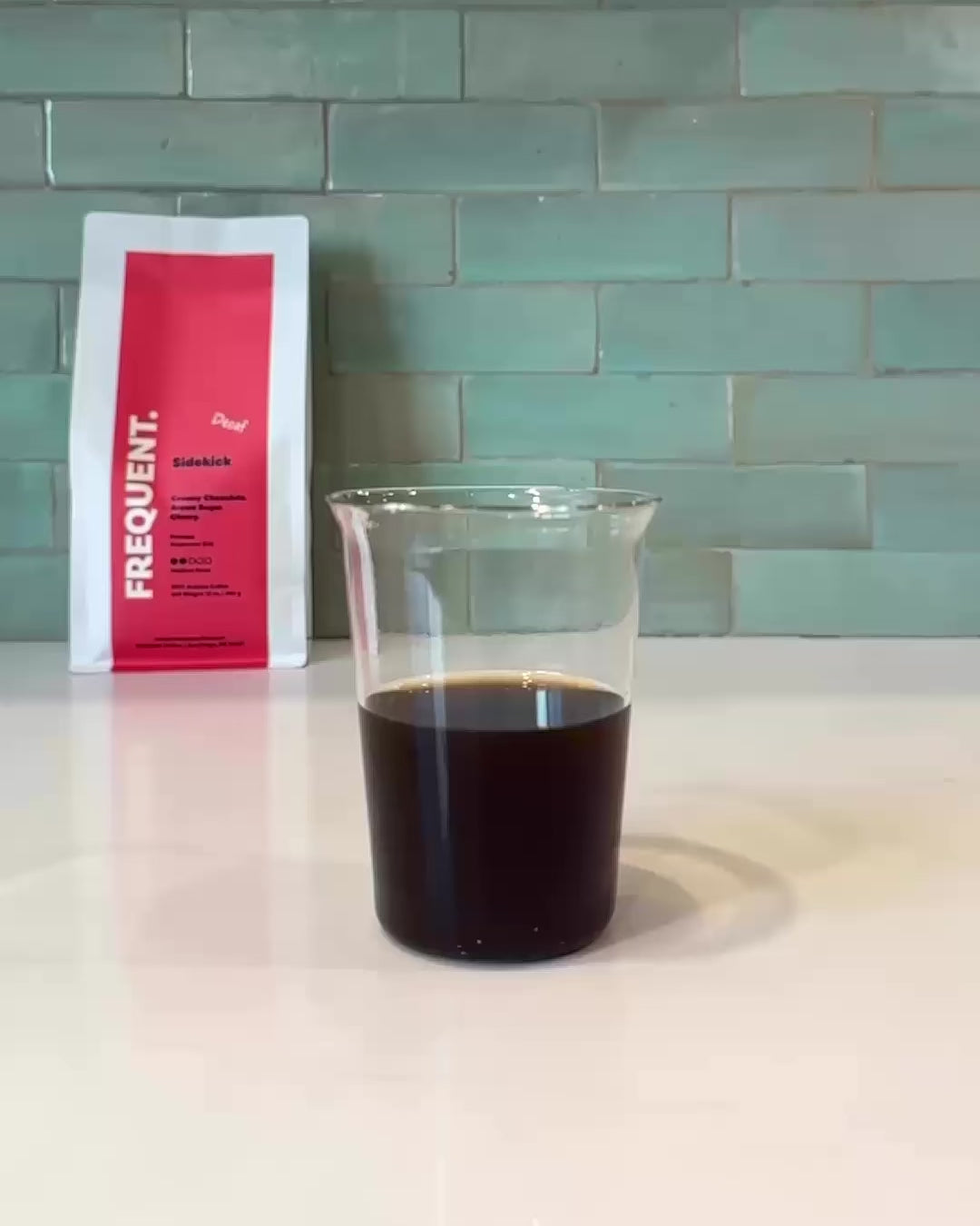 Chocolate, brown sugar, and cherries splashing into decaf coffee. 